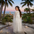 Millie's Macramé Shrug — Hand-knotted cotton fringe cape worn at sunset beach, Altysan Couture


