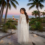 Millie's Macramé Shrug — Hand-knotted cotton fringe cape worn at sunset beach, Altysan Couture

