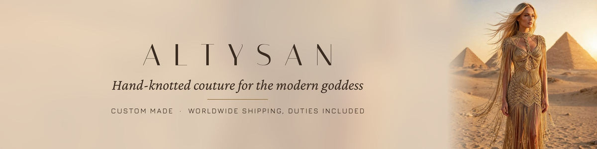 Woman in a hand-knotted gold goddess dress with long fringe at sunset, Pyramids of Giza behind her — ALTYSAN