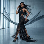 Side profile of model wearing black fringe macrame couture evening gown by ALTYSAN